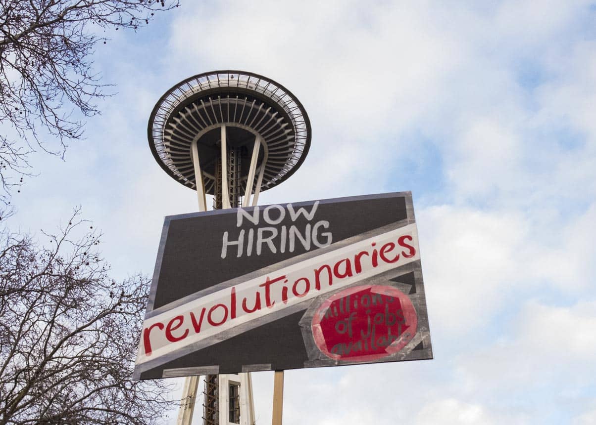 Protest signs and Space Needle